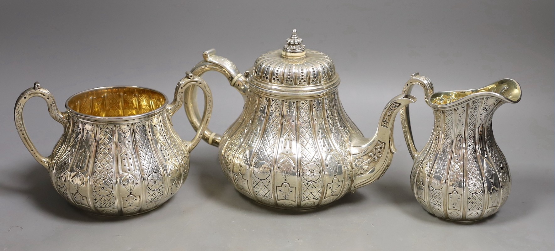 A Victorian engraved silver three piece tea set, of pear shape, by John Samuel Hunt (Hunt & Roskell late Storr & Mortimer), London, 1855/6, gross weight 45.4oz, together with original catalogue and purchase receipt, date